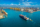 Aerial view of cargo ship and cargo container in harbor.